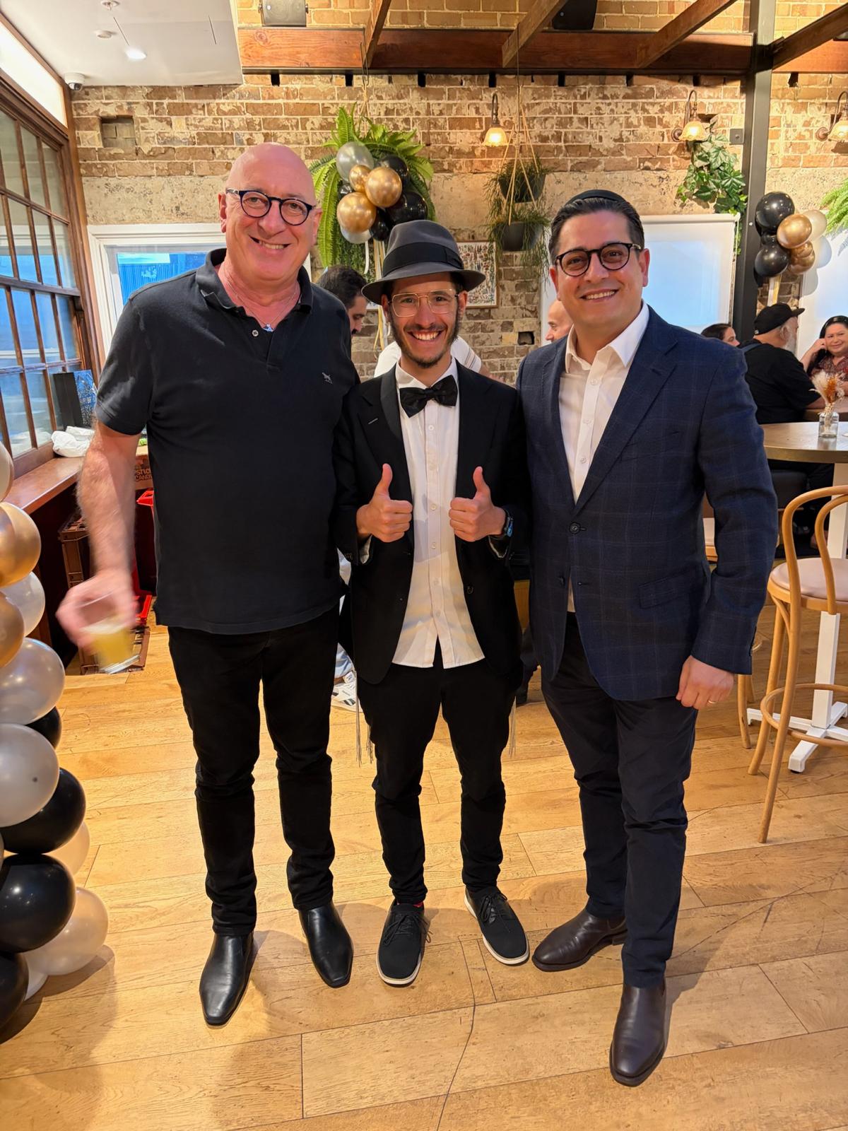 Nathan Tal celebrating at a community event